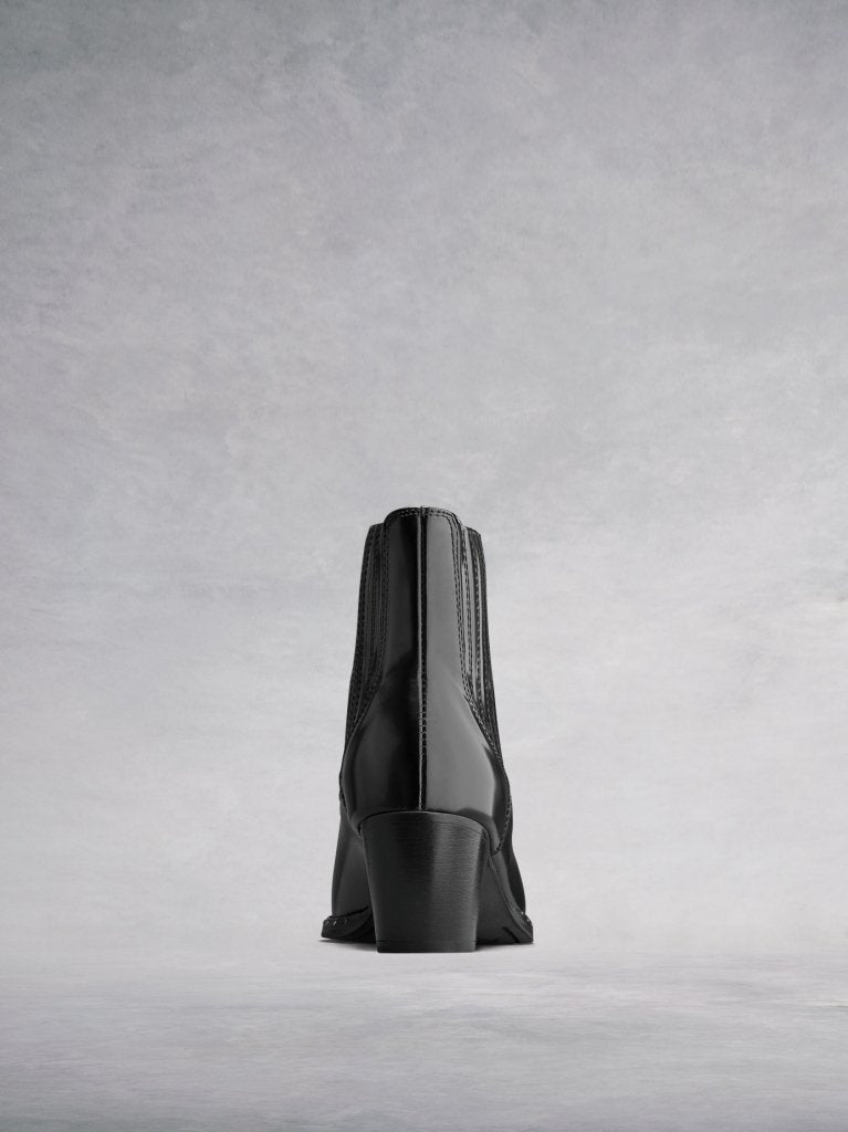 Hockley Black Leather; the back has elegant stitching and a stacked Cuban heel.