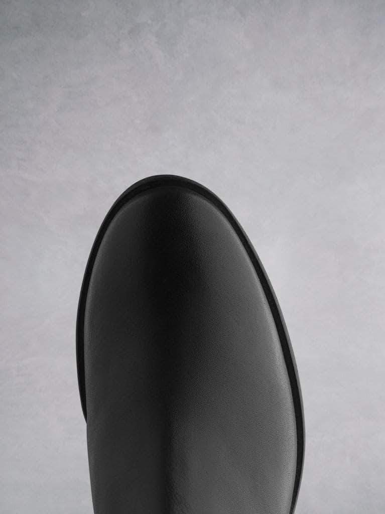 This black ankle boot has a round toe shape, that complements the block heel. 