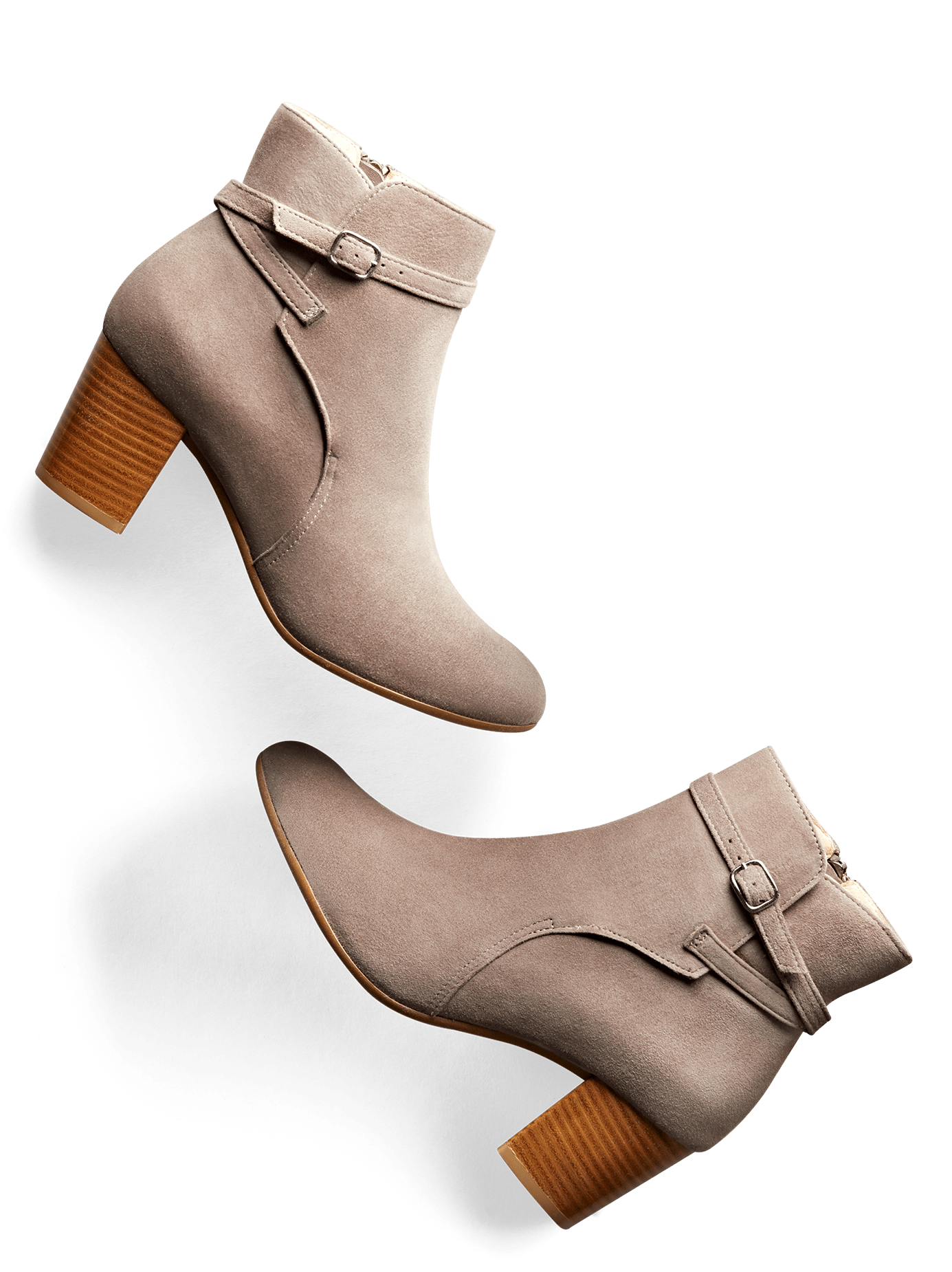 Kelston features a narrow crossover strap with buckle and a mid-height heel.
