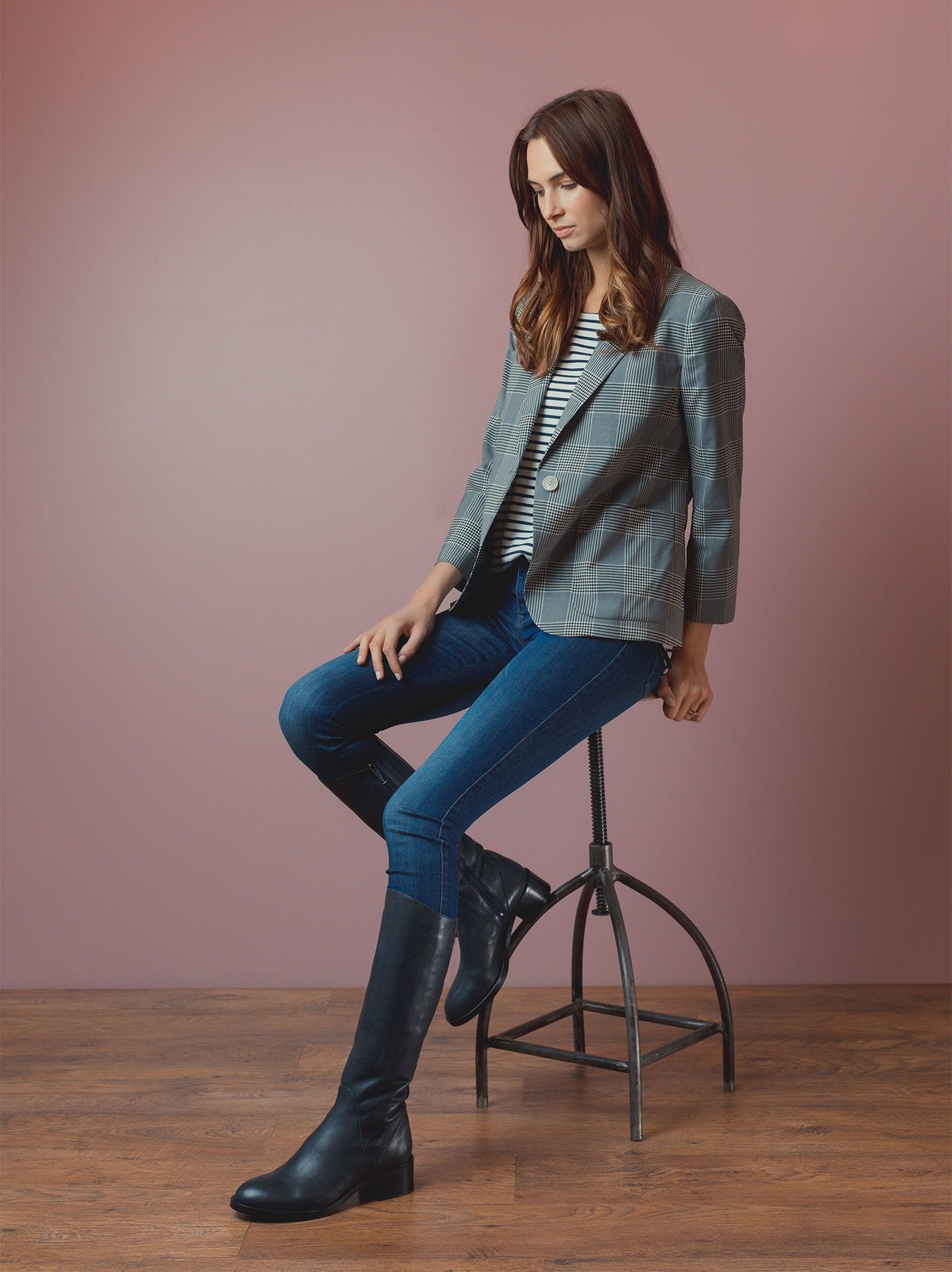 Made from luxurious navy leather, with a soft asymmetric topline.