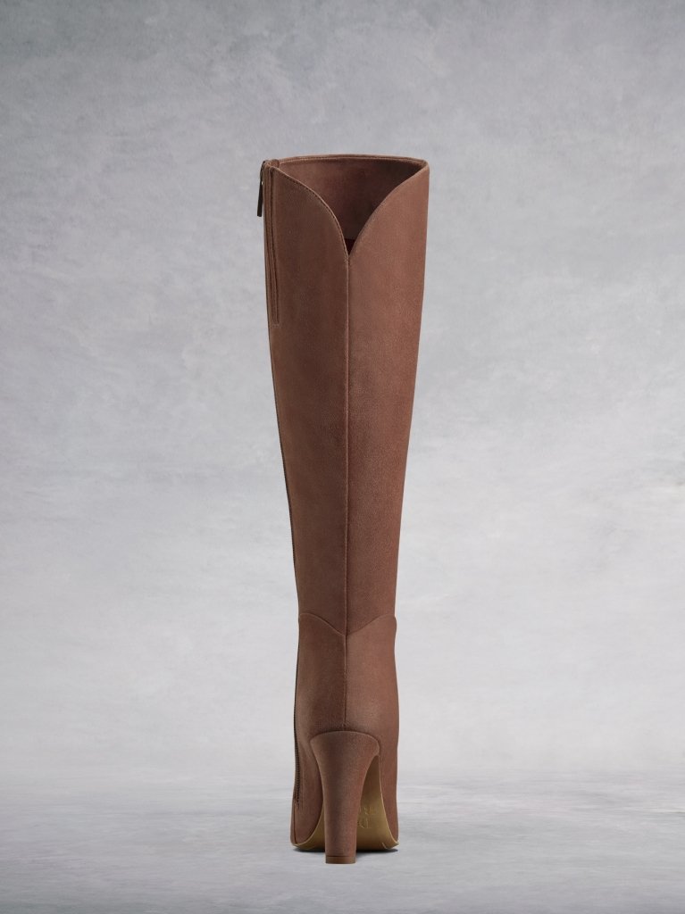 The pink suede sweetheart topline complements the curved ankle seam.