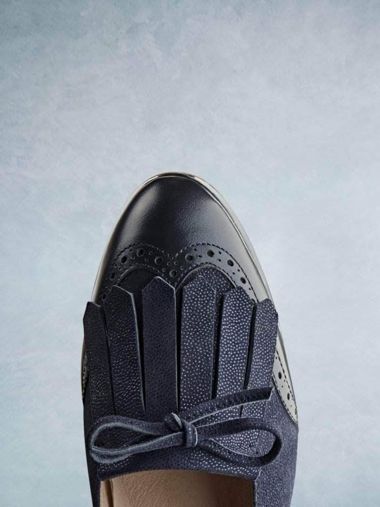 This navy pump has a sophisticated gentle almond toe shape.