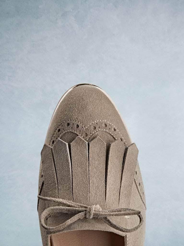 This taupe pump has a sophisticated gentle almond toe shape.