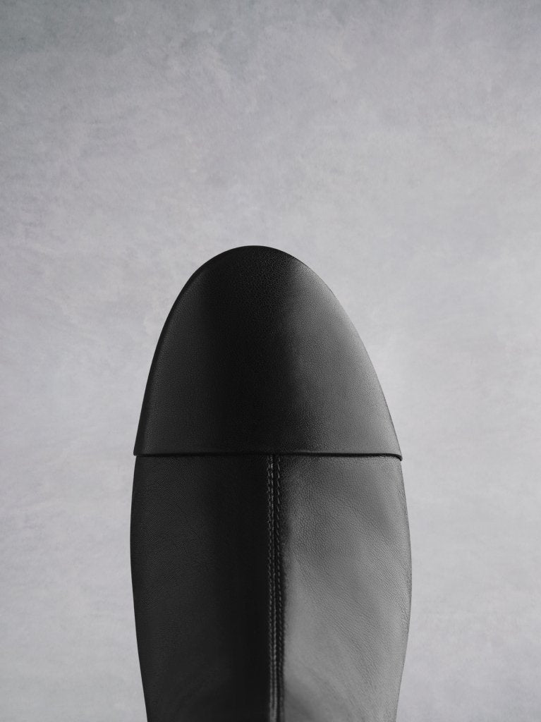The Langley has a black round toe that contrasts the brown stacked heel. 