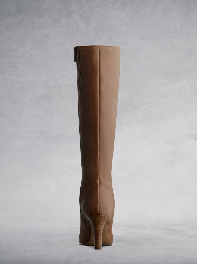 The tan Luxor features a flattering lower back from the curved topline.  