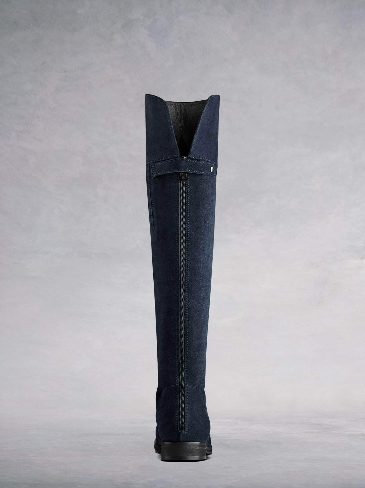 This OTK boot has a subtle full length back zip and a soft leather lining.