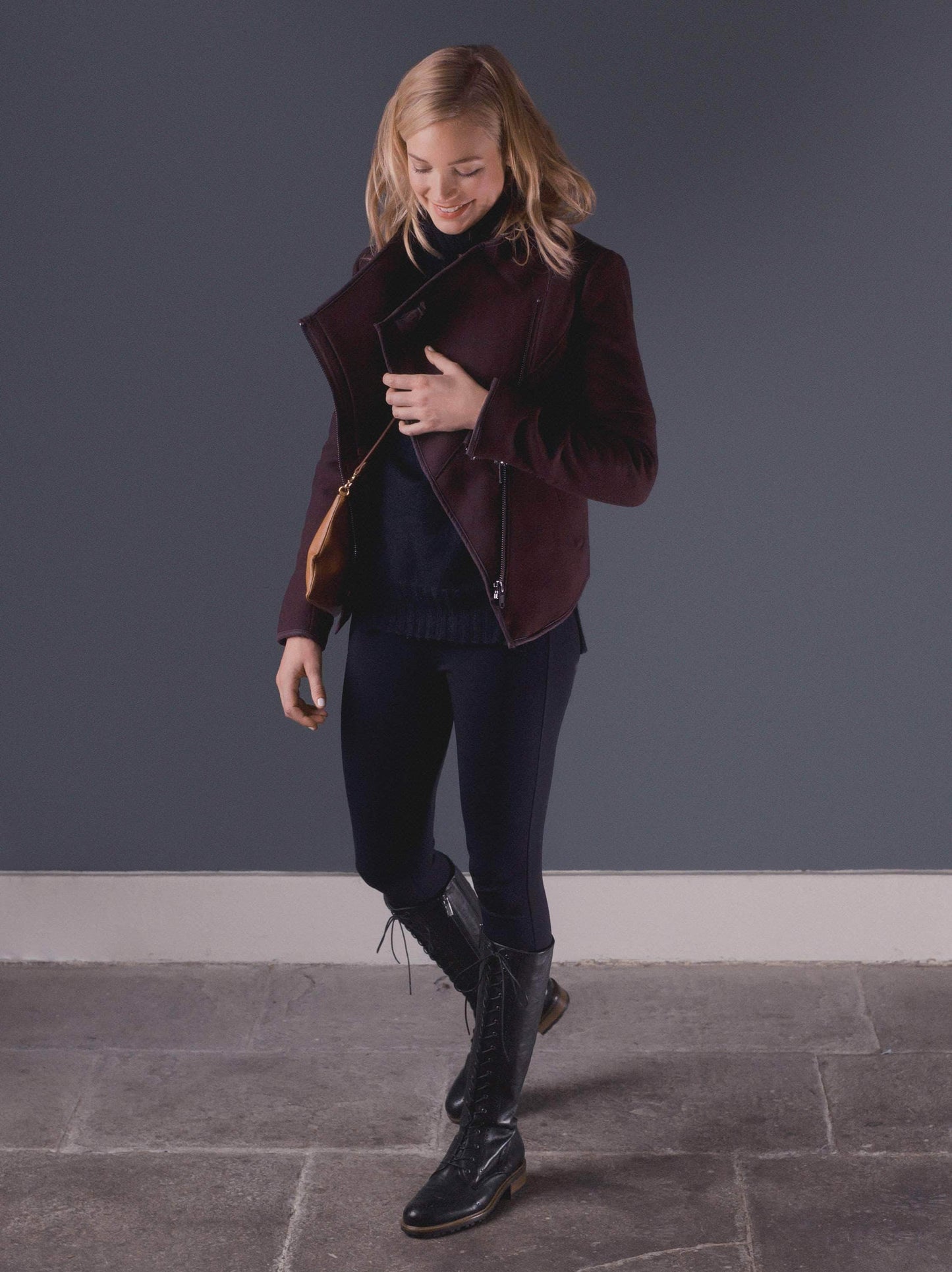 Marvel, a lace up knee high boot in black leather with stylish brogue detailing.