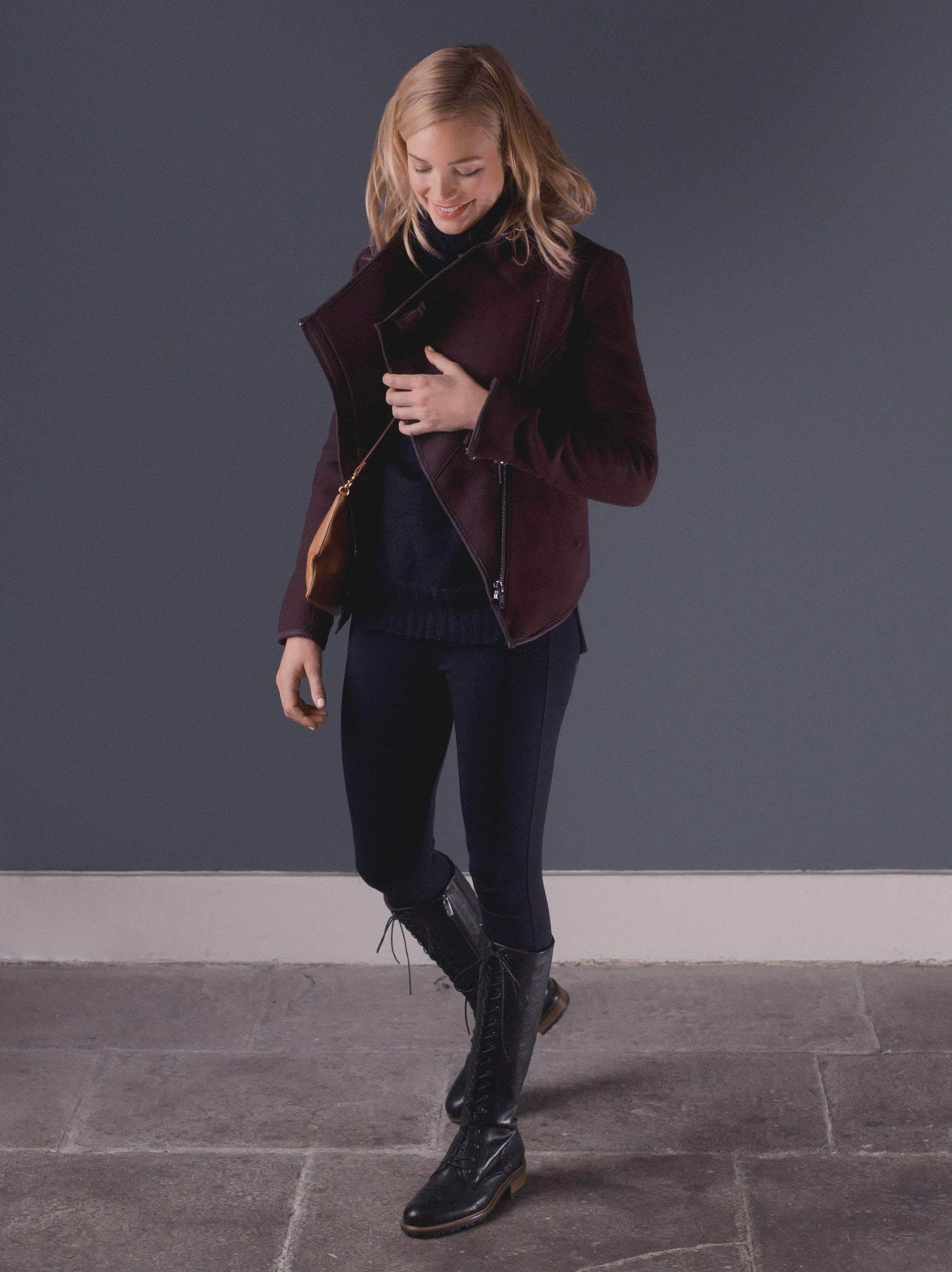 Marvel, a lace up knee high boot in black leather with stylish brogue detailing.