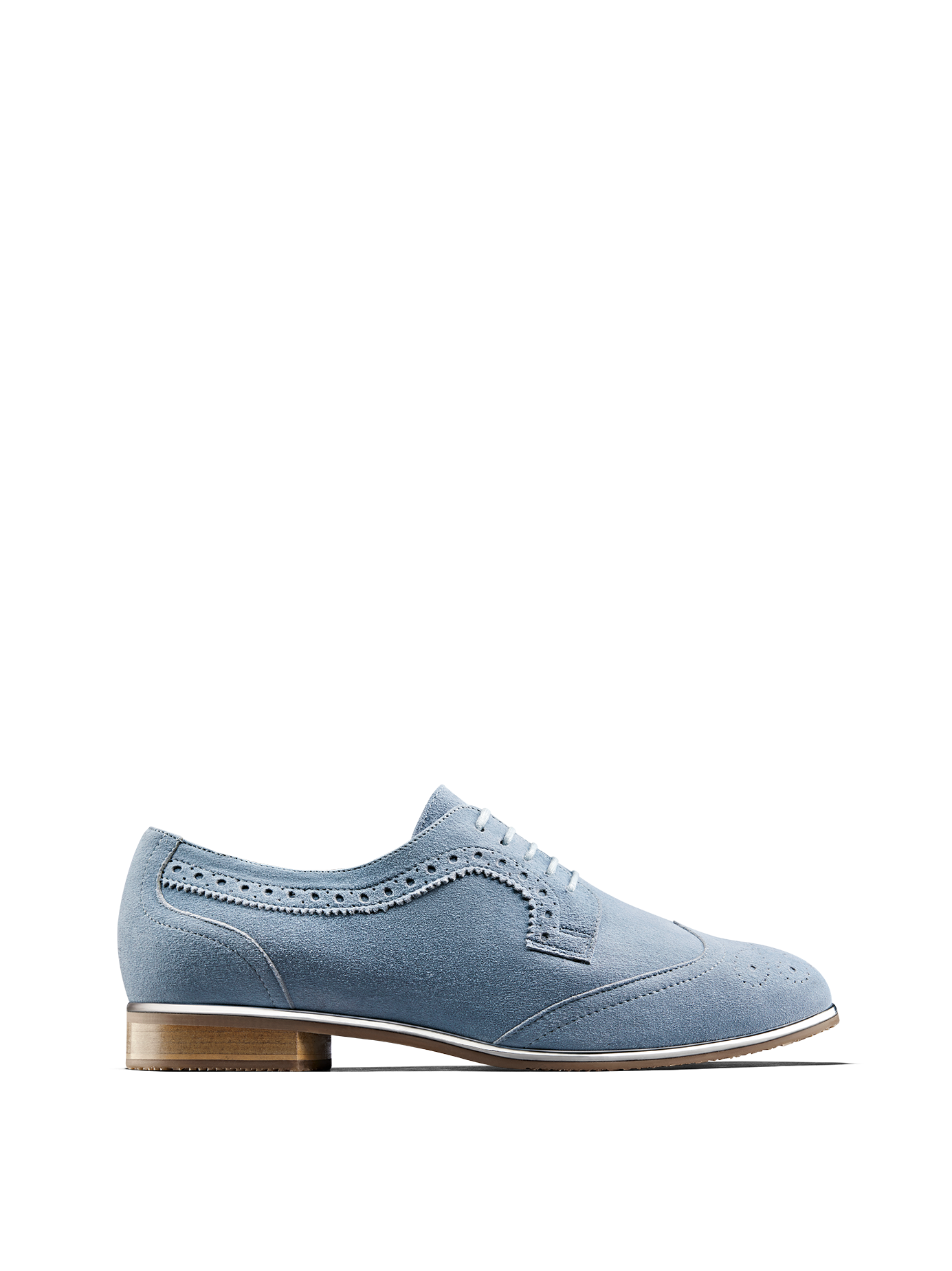 Mullion in chambray blue suede, a brogue shoe with a metallic gun metal trim.
