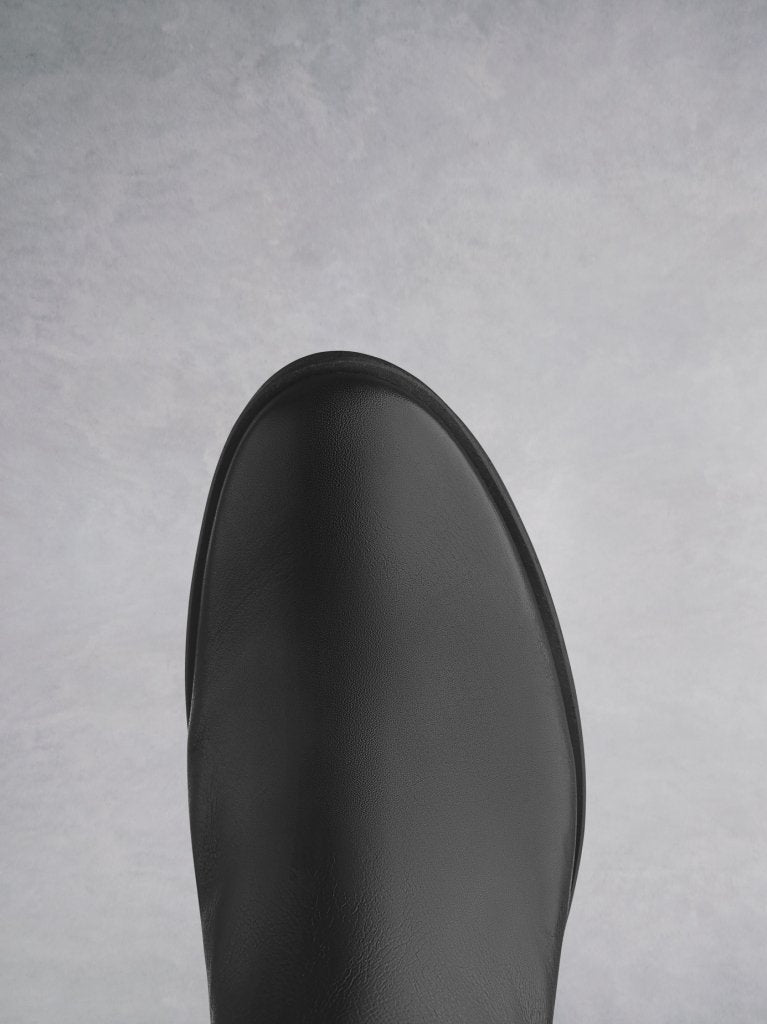 Orpheus has a black round toe complementing the shape of the block heel. 