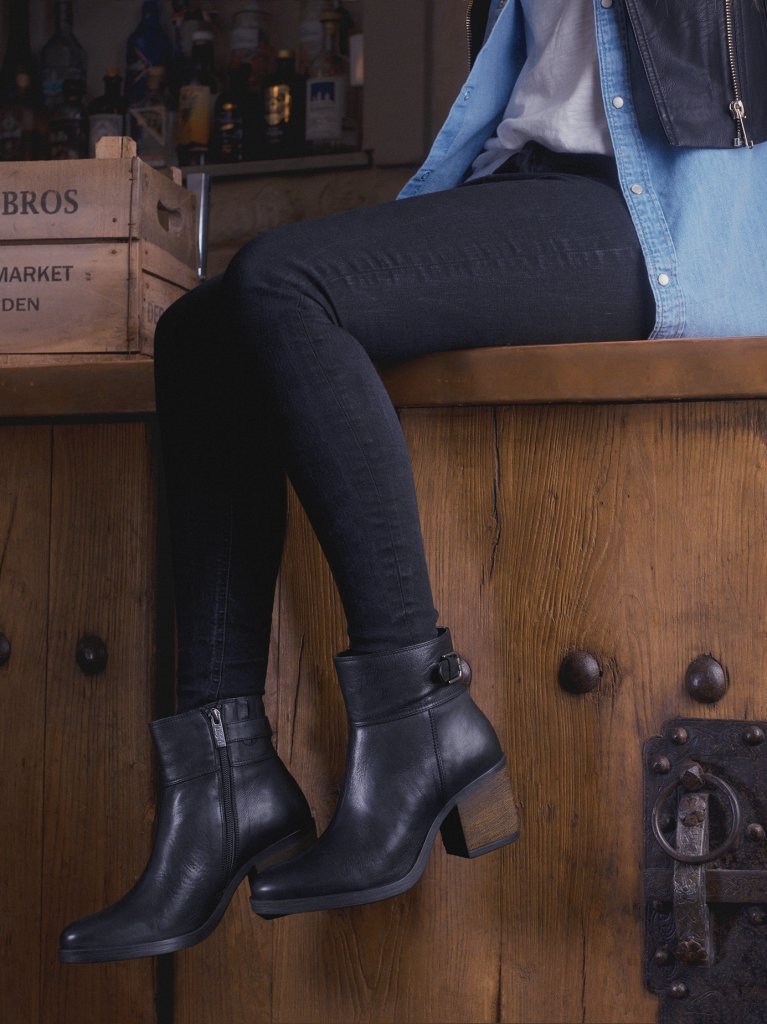 Everyday black ankle boots, with a strap buckle detailing around the ankle. 