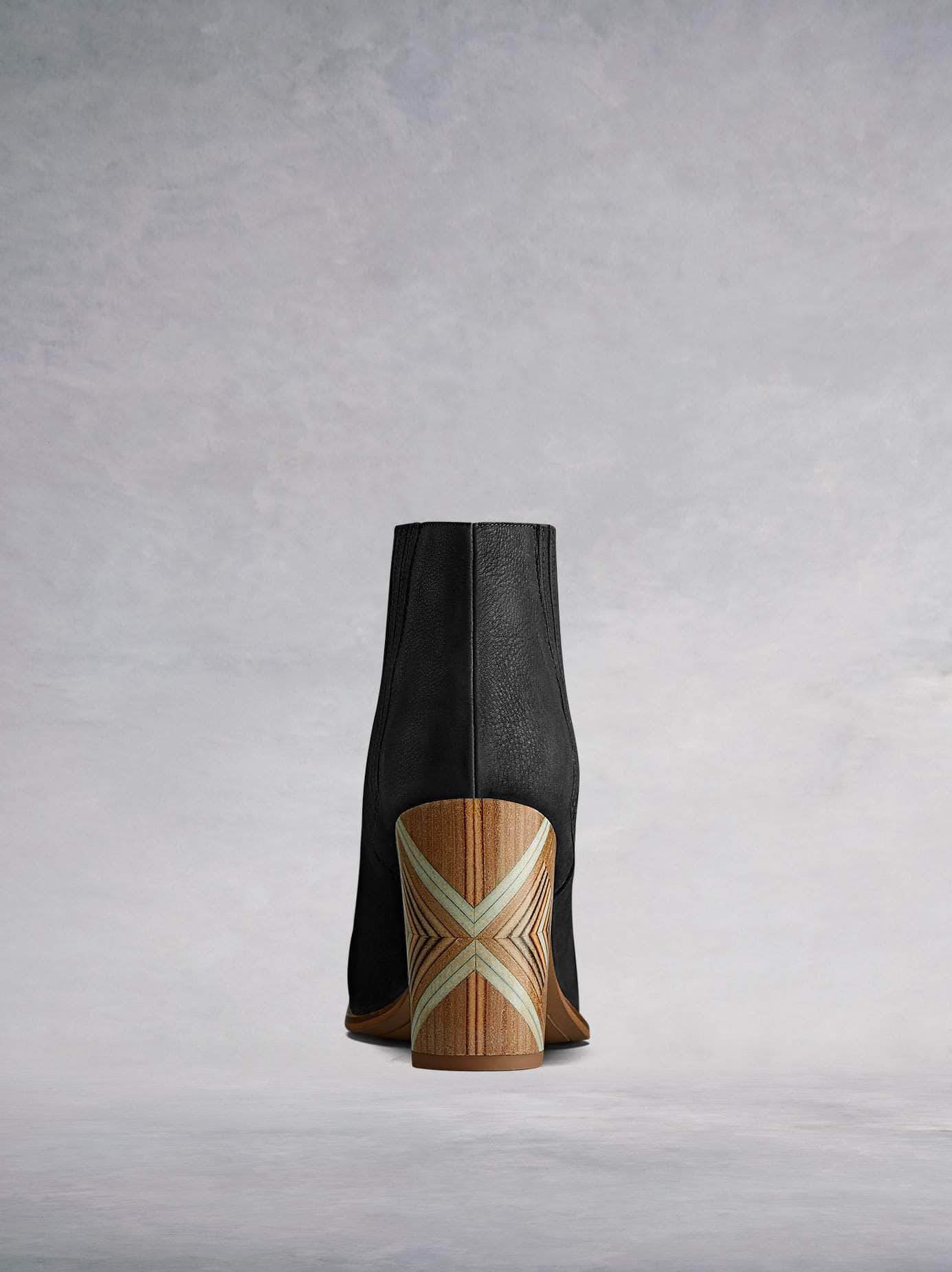 The handcrafted block heel on Paragon black has a unique statement pattern.