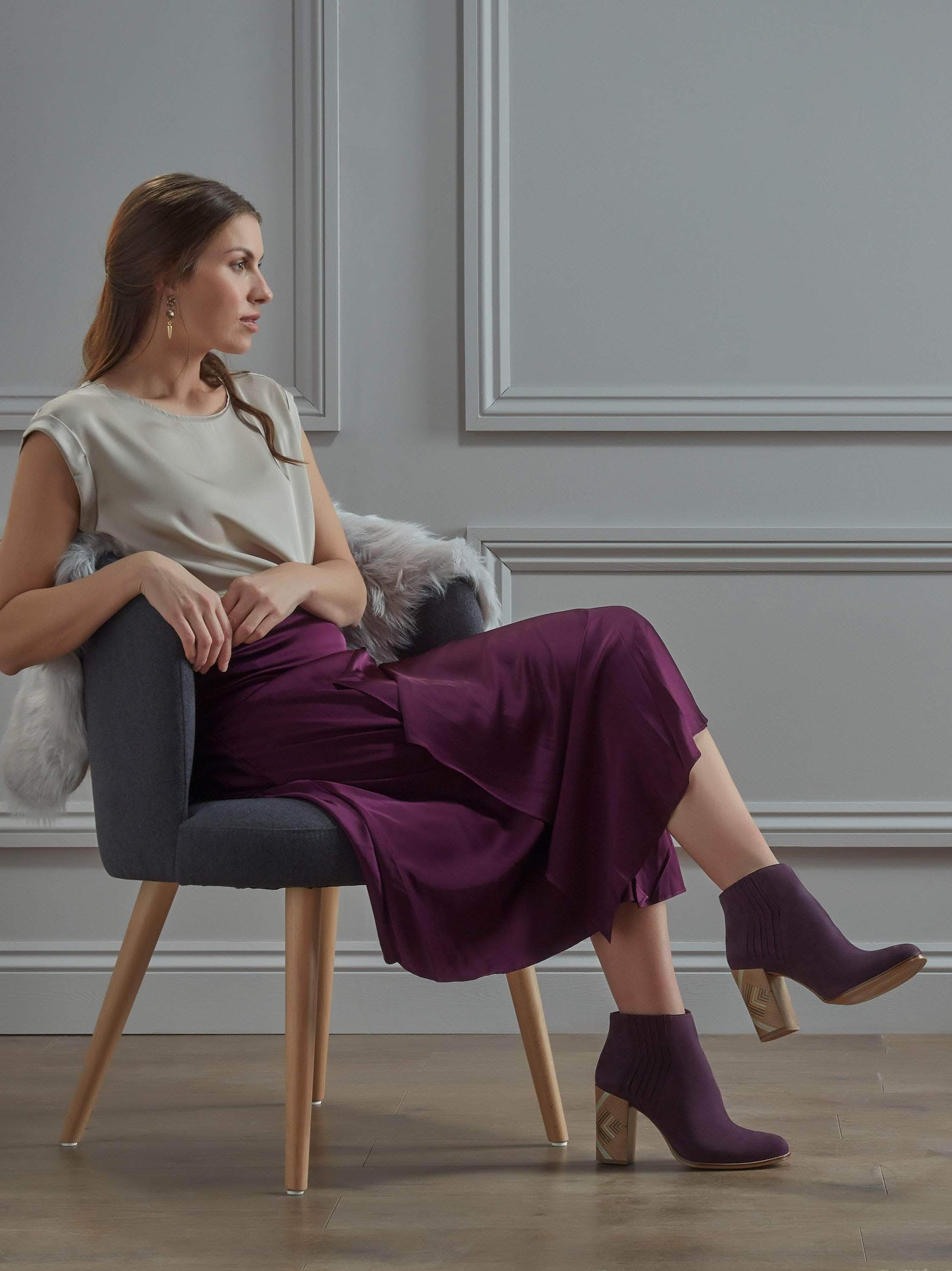 Crafted from purple nubuck leather with zig-zag stitching and a patterned heel.
