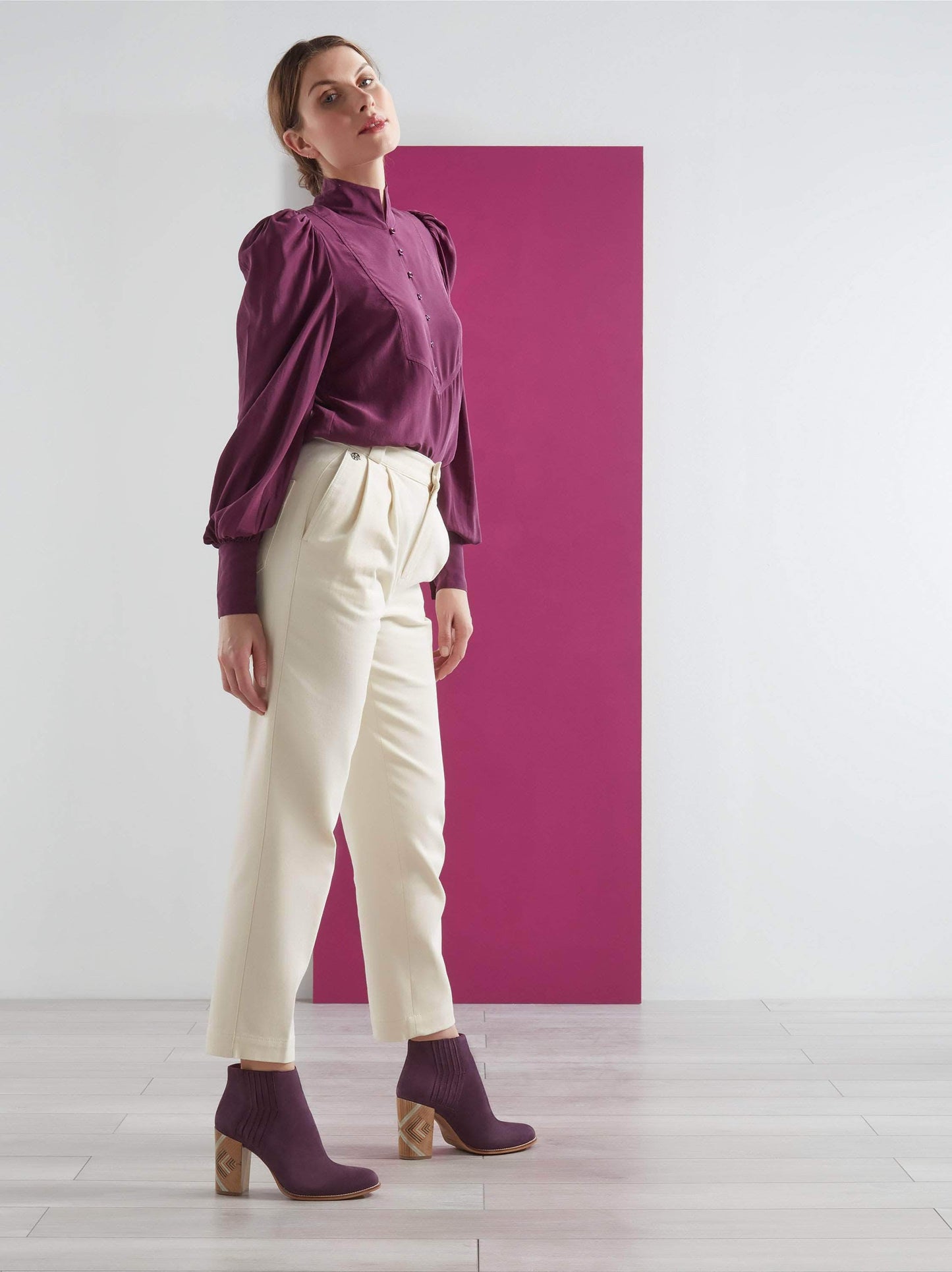 Crafted from purple nubuck leather with zig-zag stitching and a patterned heel.