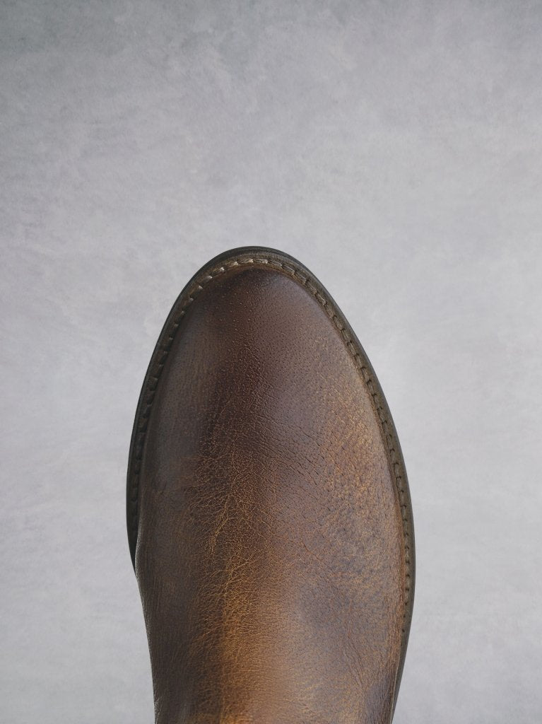 The tan almond shaped toe that complements the western style. 