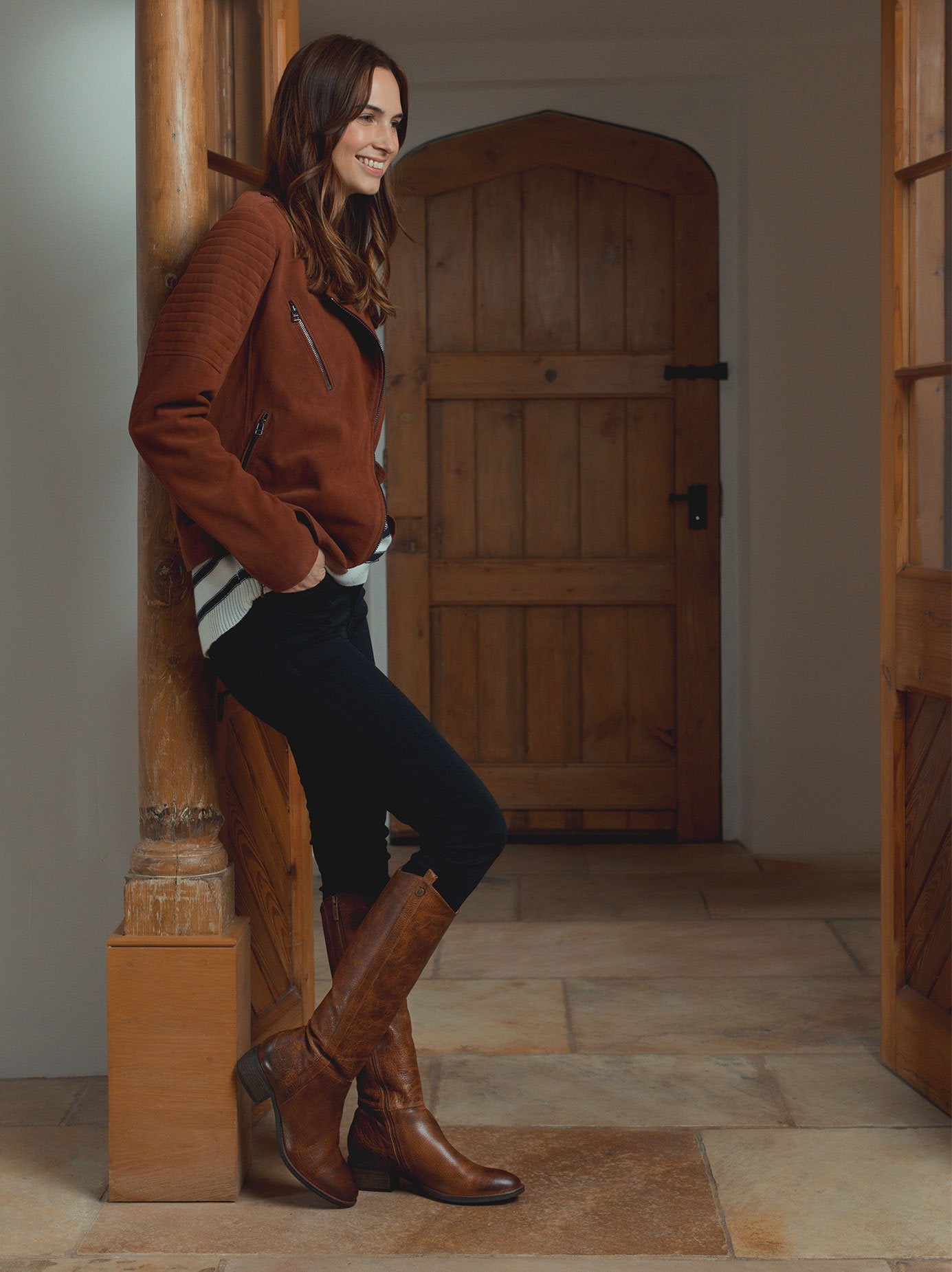 The staple tan boot has a curved topline - both stylish and practical. 