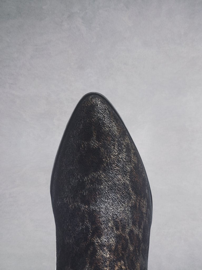 The chic Pixie boot in leopard suede has an elegant pointed toe. 