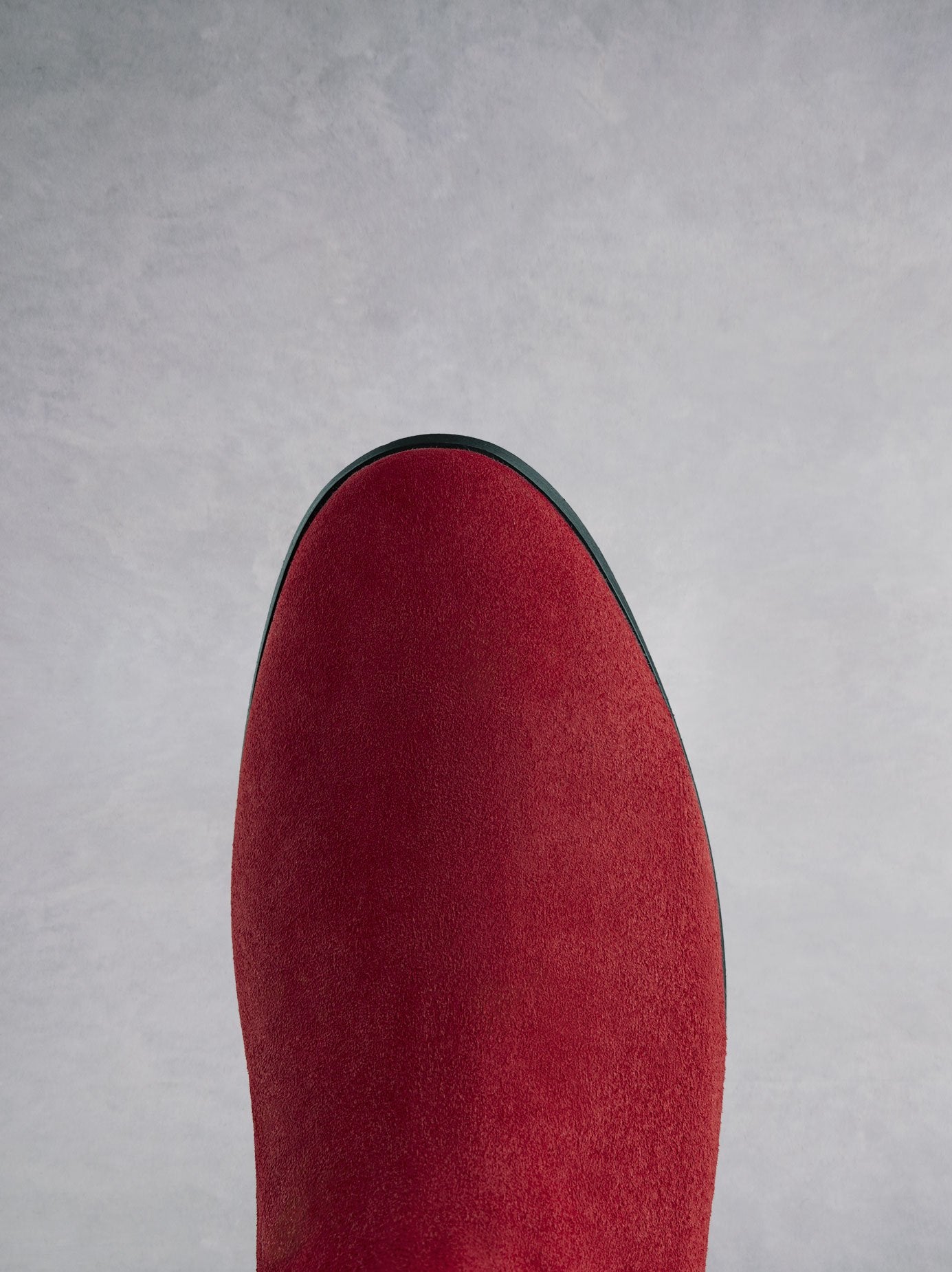 Featuring a red suede round toe that looks both elegant and classic. 
