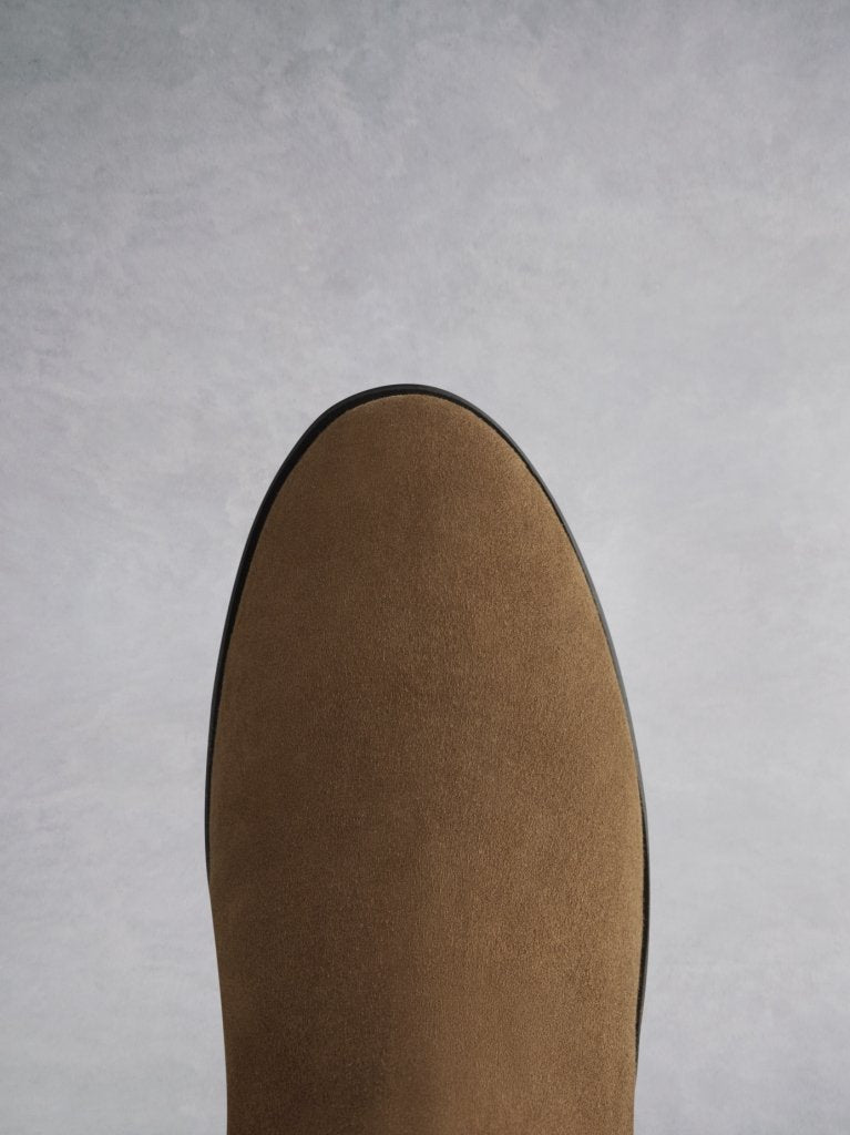 Featuring a tan suede round toe that looks both elegant and classic.