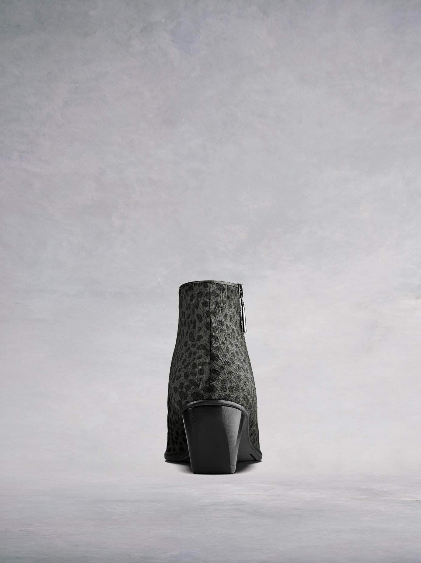 This ankle boot has a complementary bespoke angular shaped block heel in black.