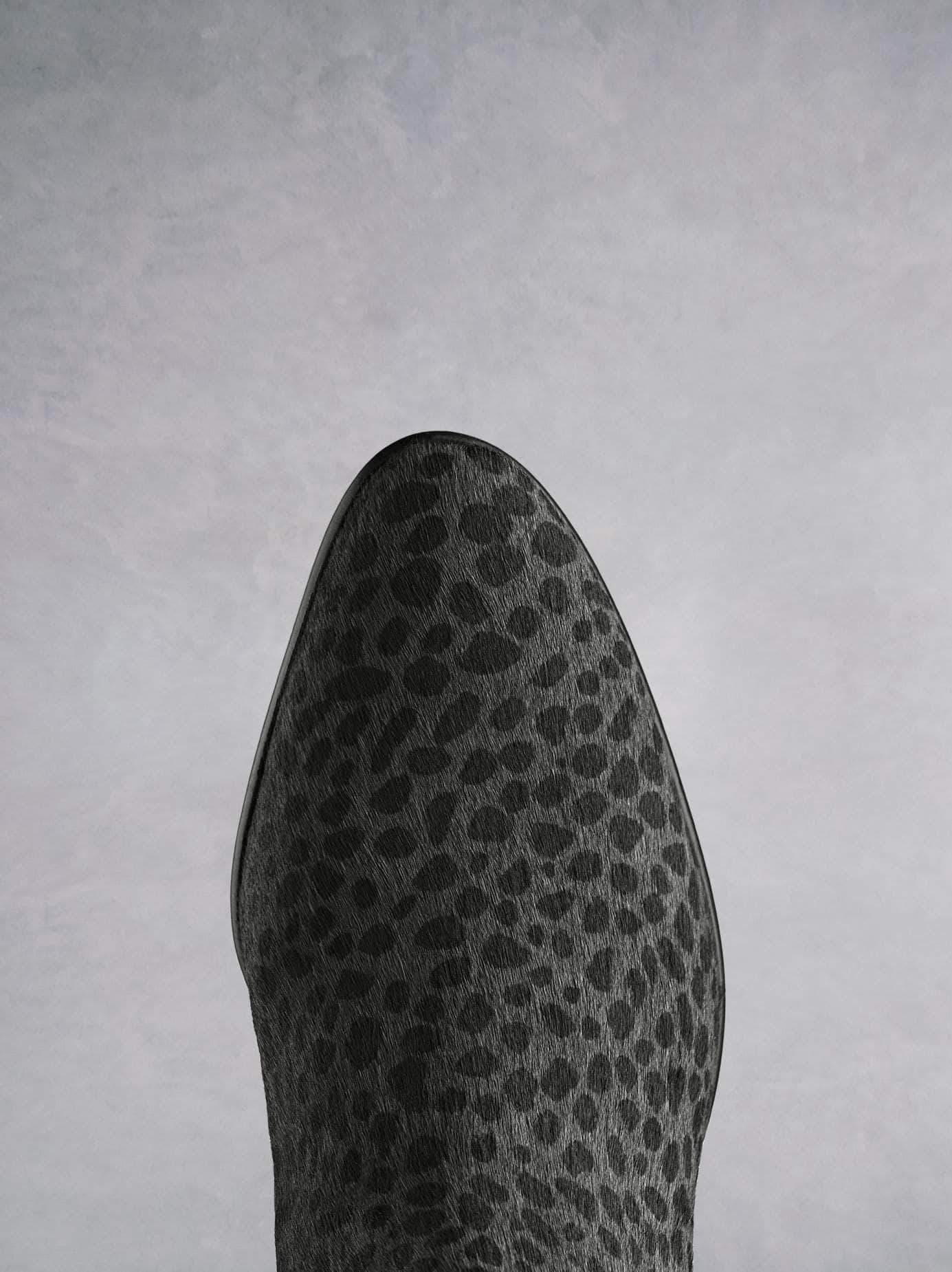 Renata, in grey leopard hair leather has a stylish almond toe shape. 