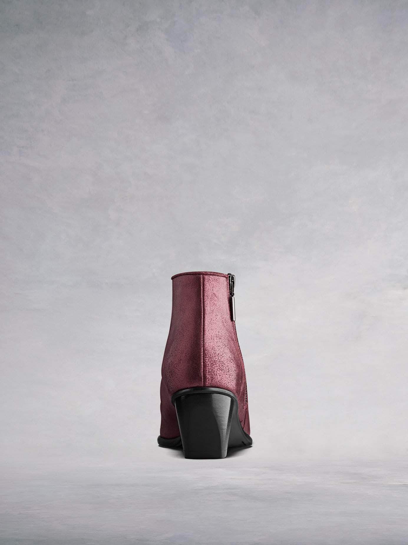 This ankle boot has a complementary bespoke angular shaped block heel in black.