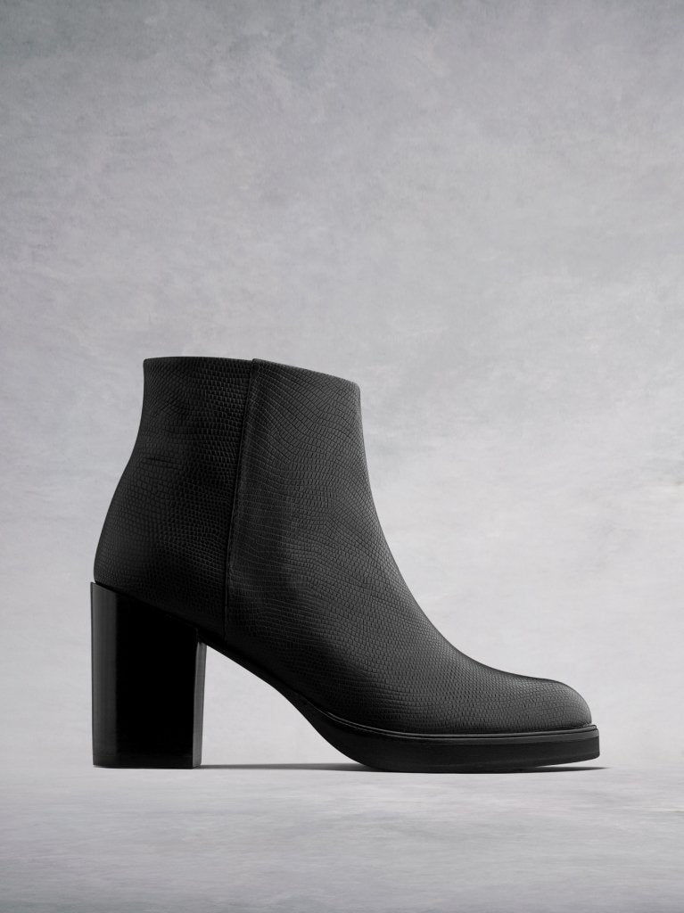The Ryton - a high heeled ankle boot in black lizard embossed leather. 