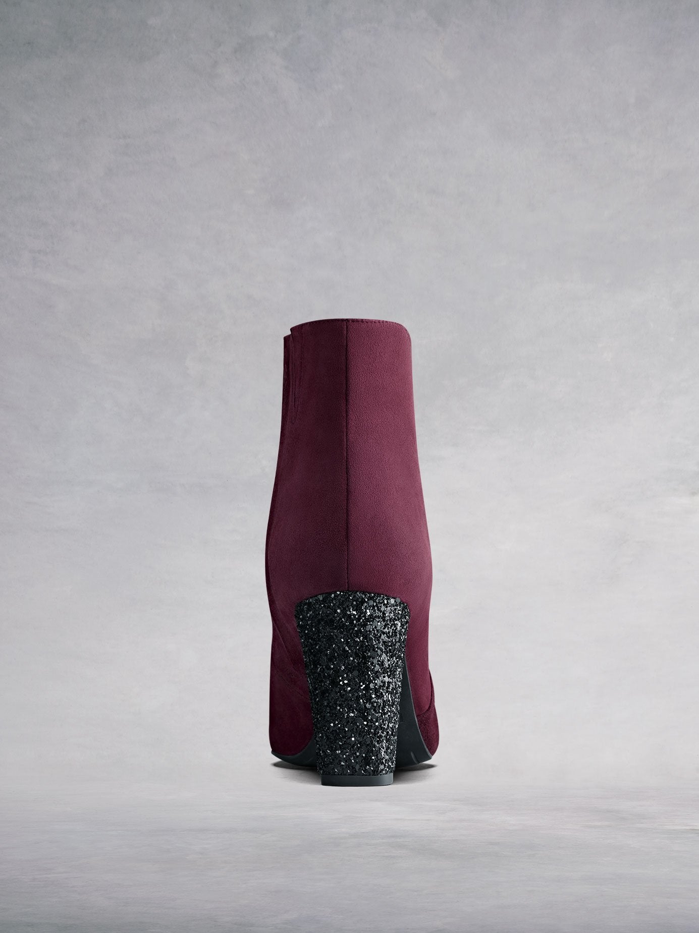 The glitter-covered block heel will be sure to add some edge to your wardrobe.