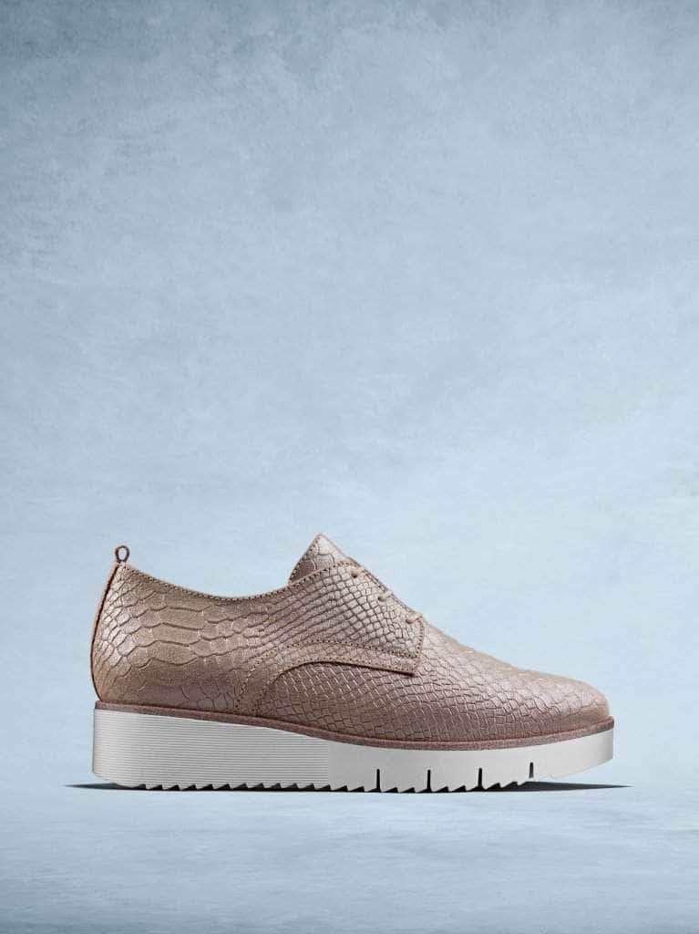 Sennen is our statement platform trainer made from rose mock croc leather. 