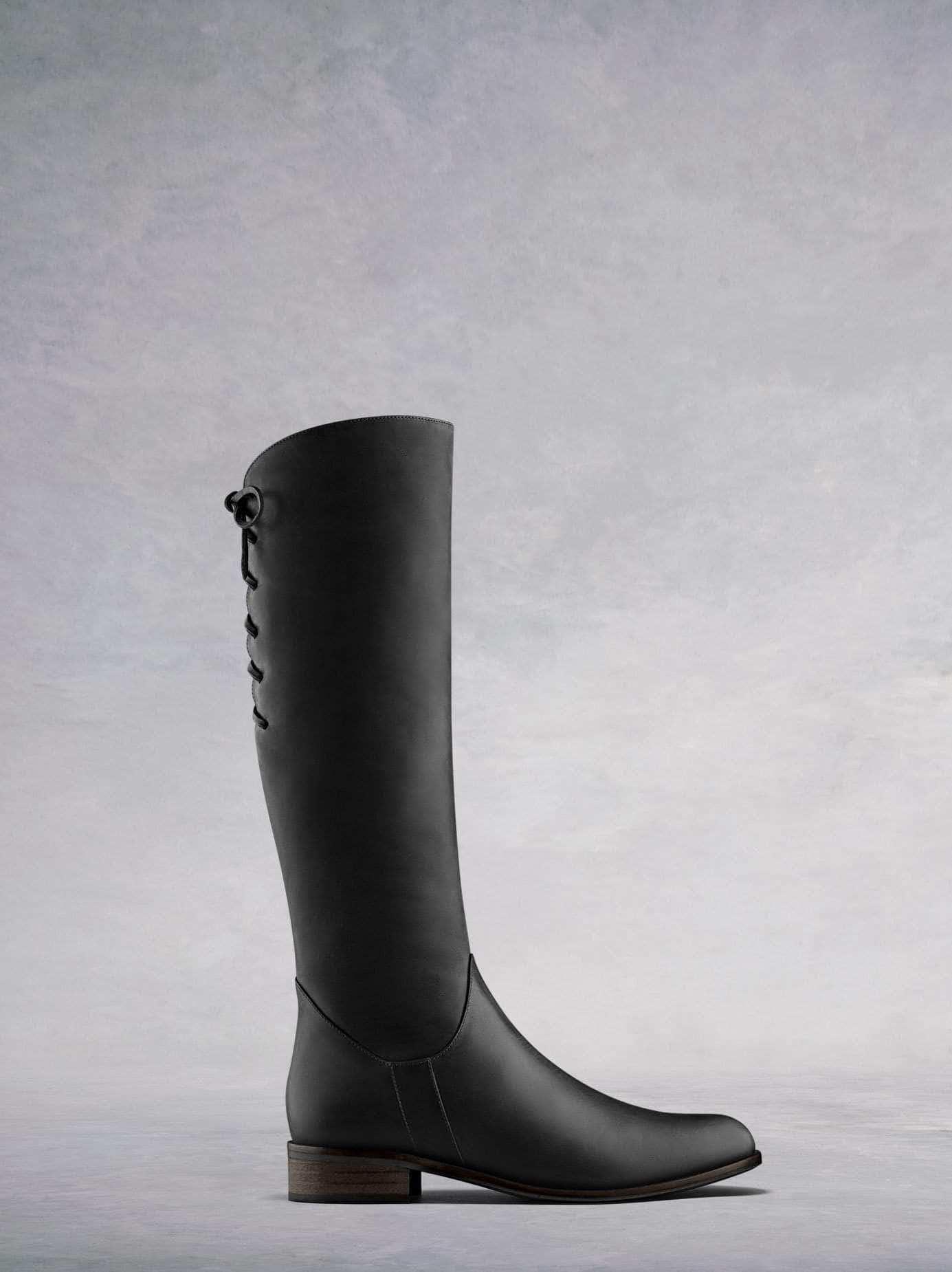 Thornbank, a rustic brown leather knee high boot with lace up detailing.