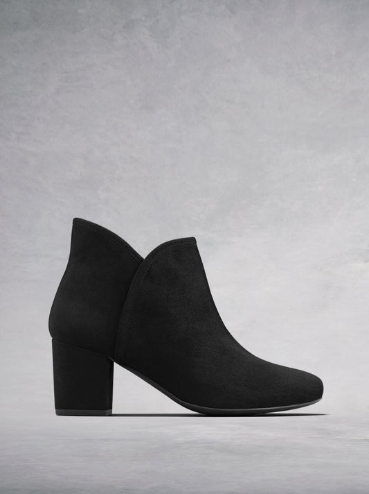 The Tigerlily, a versatile black suede ankle boot with a sweetheart topline.