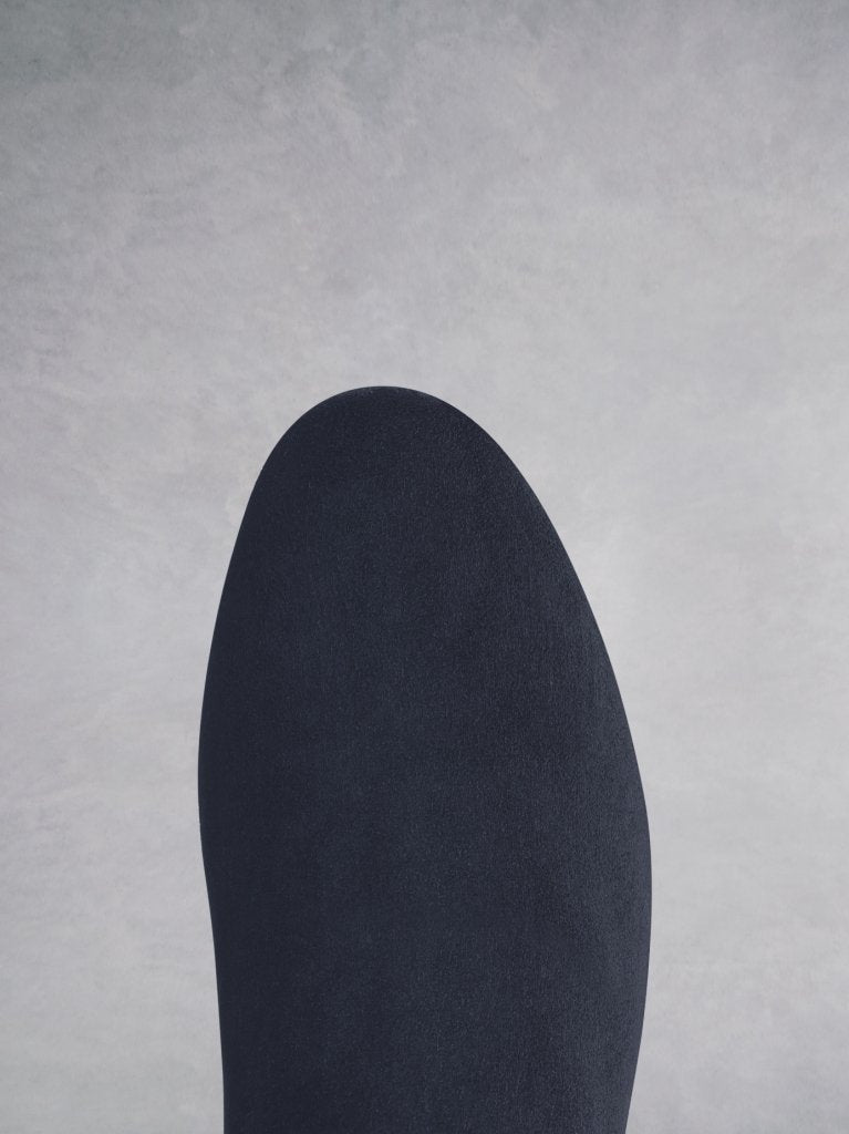 Tigerlily navy suede; the round toe shape complements the curved topline seam. 