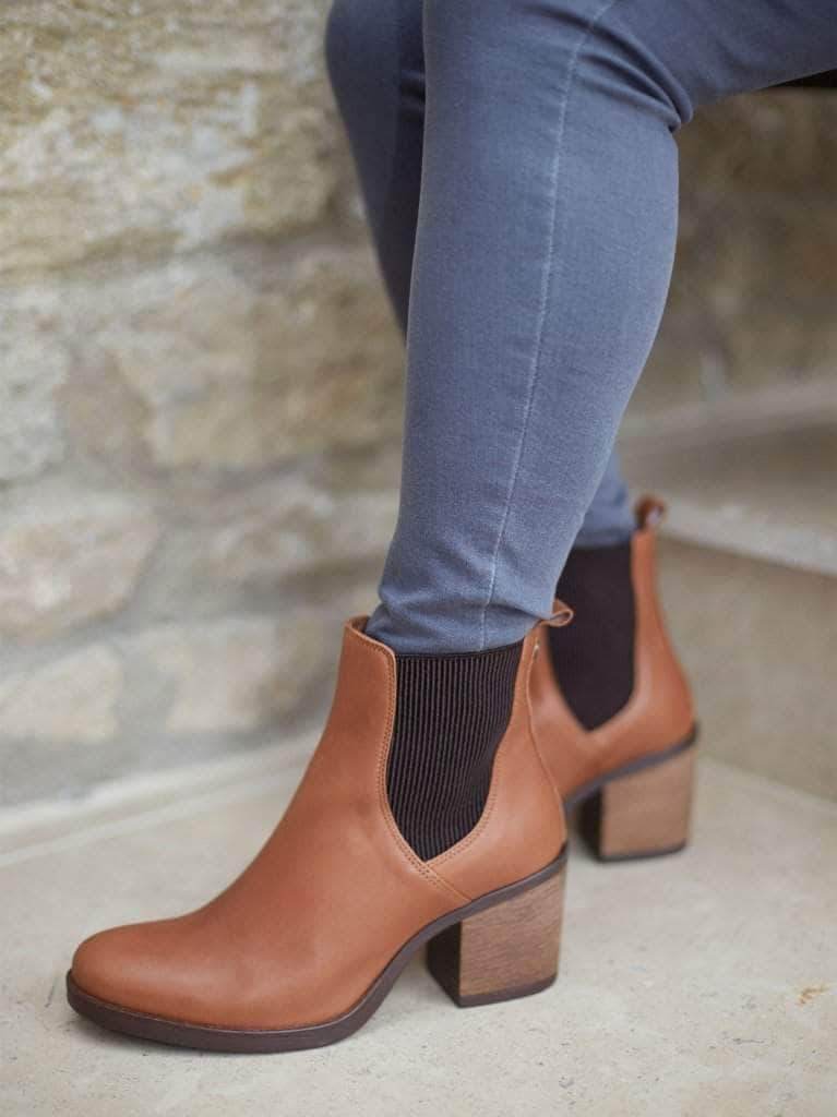 This staple tan ankle boot can be worn with jeans or midi dresses or skirts. 