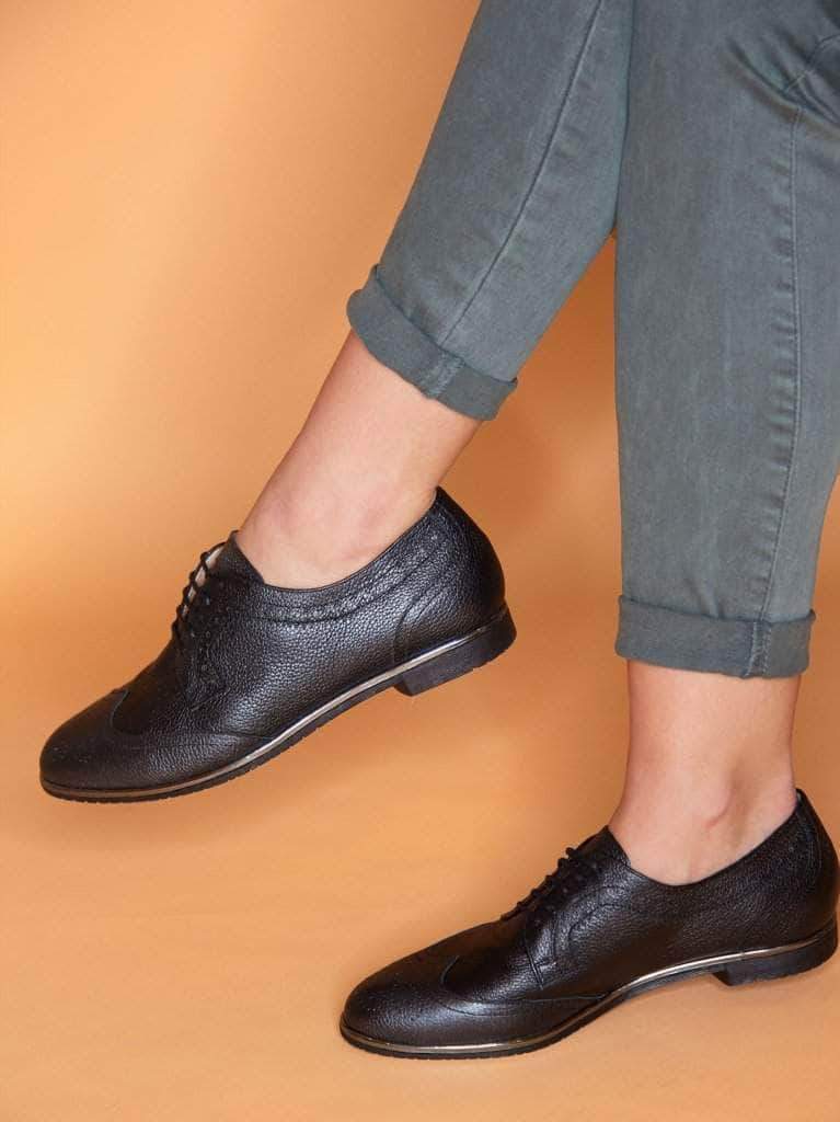 This formal black brogue shoe has a contrast gun metal trim around the sole. 