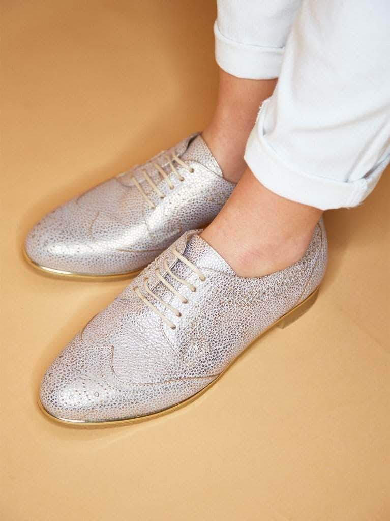 This statement brogue shoe has a contrasting silver trim around the sole. 